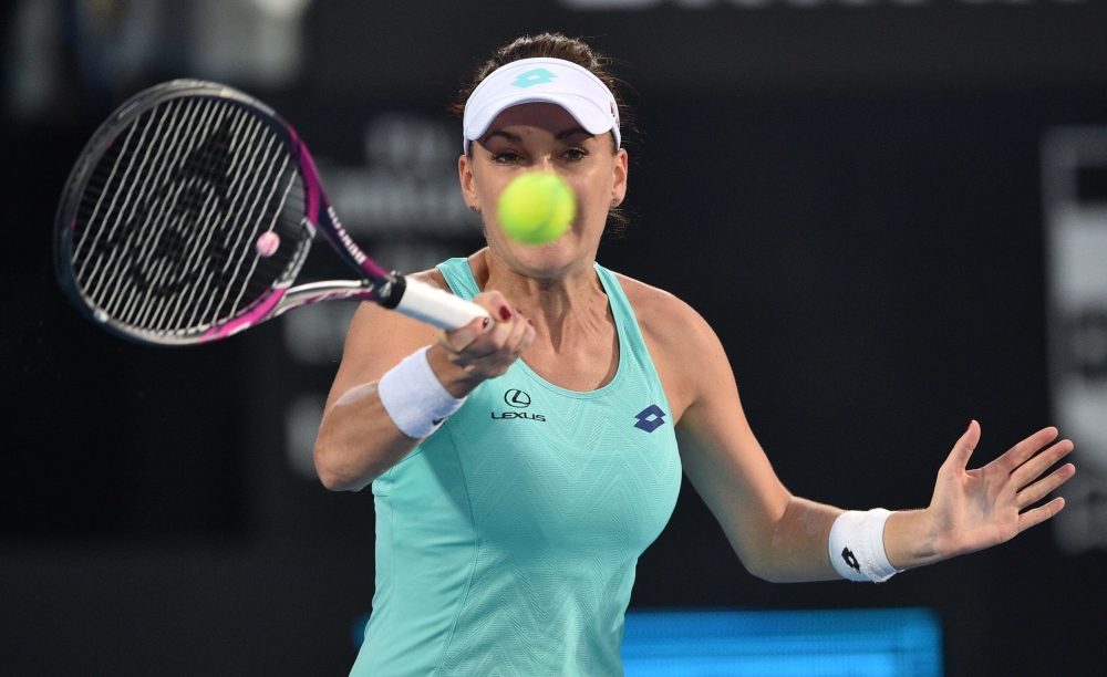 Agnieszka Radwanska hits a return to Camila Giorgi of Italy in their women's singles quarterfinal match at the Sydney International tennis tournament in Sydney on Thursday. — AFP