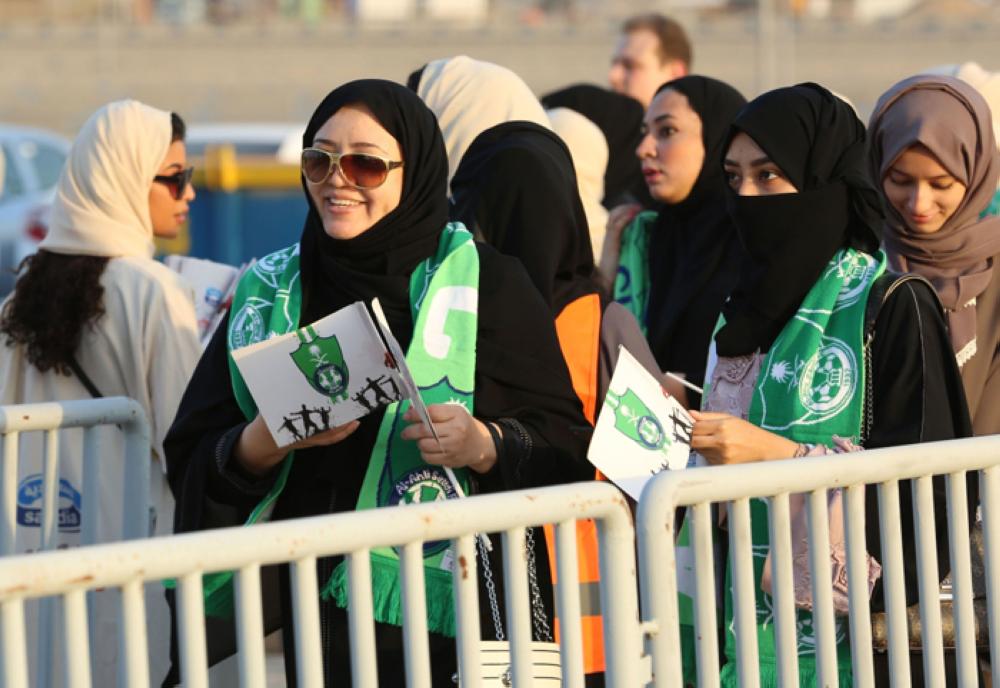 Saudi Women in scarves and hats cheer their clubs in Jeddah Stadium for the first time