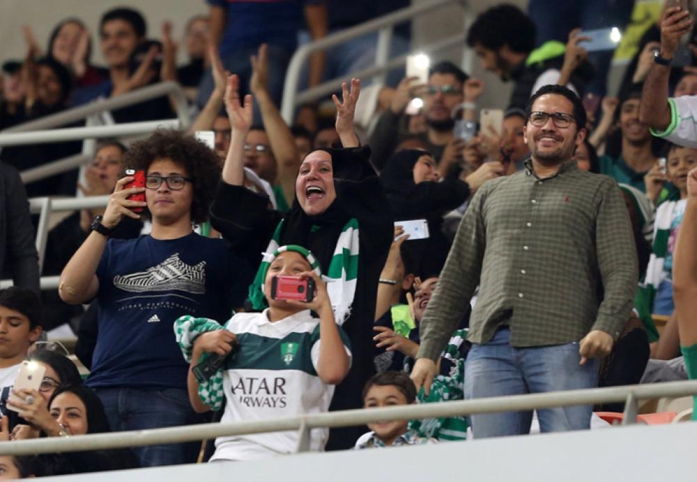 Al-Ahli's Giannis Fetfatzidis (L) vies for the ball with Al-Batin's Maan Khodari during their football match in the Saudi Pro League at the King Abdullah Sports City in Jeddah on Friday —AFP