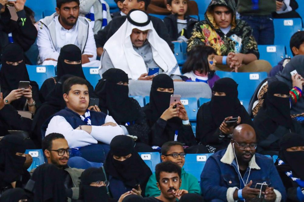 Saudi women arrive to watch the soccer match between Al- Hilal club against Al Ittihad club at the King Fahd stadium in Riyadh, Saudi Arabia Saturday. — Reuters
