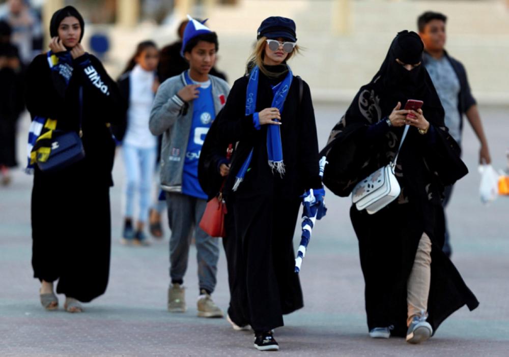 Saudi women arrive to watch the soccer match between Al- Hilal club against Al Ittihad club at the King Fahd stadium in Riyadh, Saudi Arabia Saturday. — Reuters