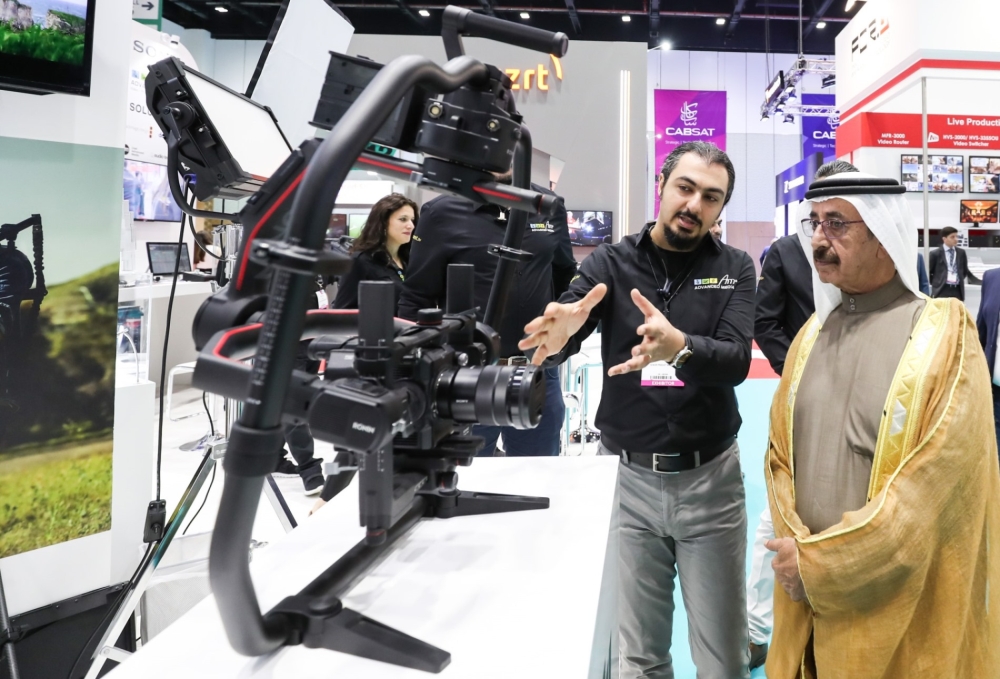 Sheikh Hasher Bin Maktoum Al Maktoum, director general of Dubai's Department of Information officially who opened CABSAT 2018, the Middle East & Africa’s largest cable, satellite and broadcast event, is being briefed by a exhibitor during his tour of the exhibition. — Courtesy photo