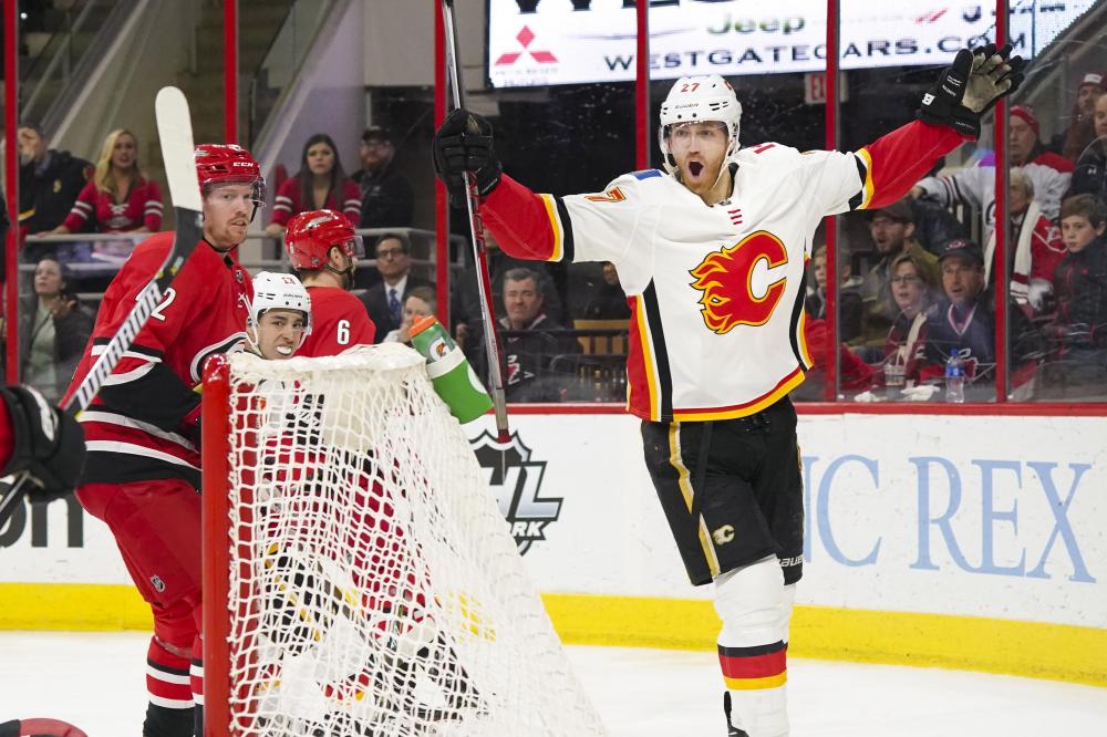 Calgary Flames’ defensemen Dougie Hamilton celebrates his third period goal against the Carolina Hurricanes at PNC Arena in Raleigh Sunday. — Reuters