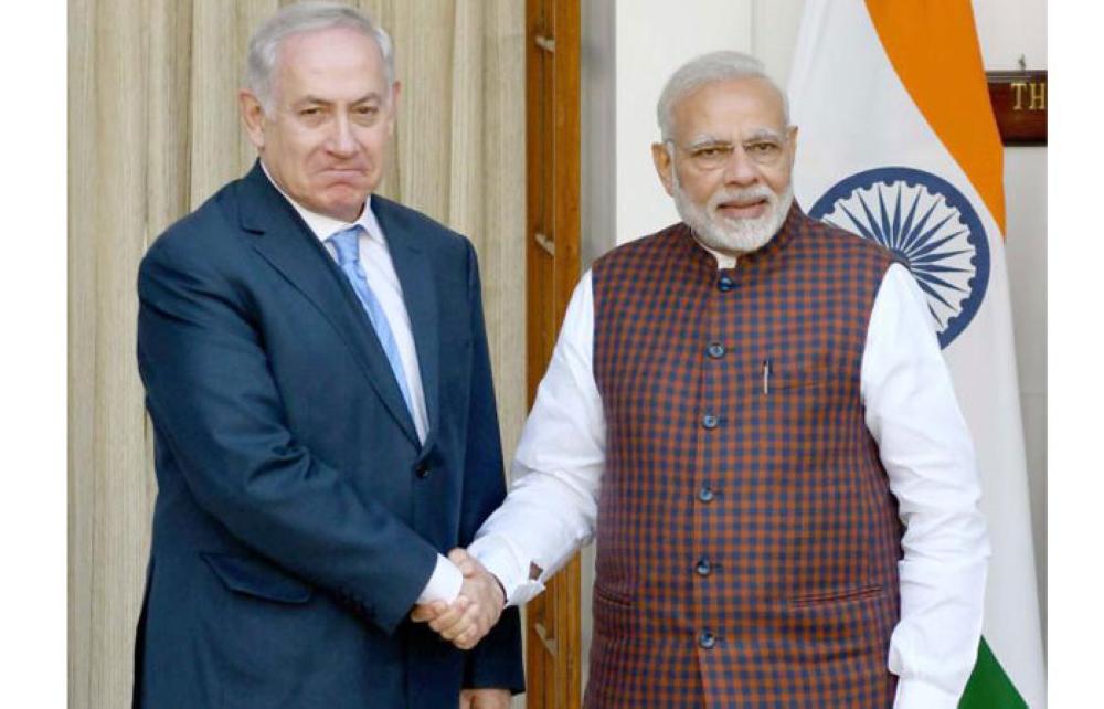 Indian Prime Minister Narendra Modi (right) shakes hand with Israeli Prime Minister Benjamin Netanyahu before a meeting at Hyderabad House in New Delhi, Monday. — AFP
