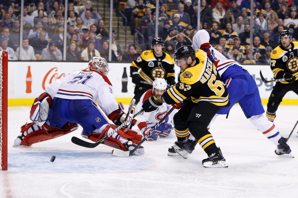 Boston Bruins left wing Brad Marchand (63) scores a goal on Montreal Canadiens goalie Carey Price (31) during the third period at TD Garden. — Reuters