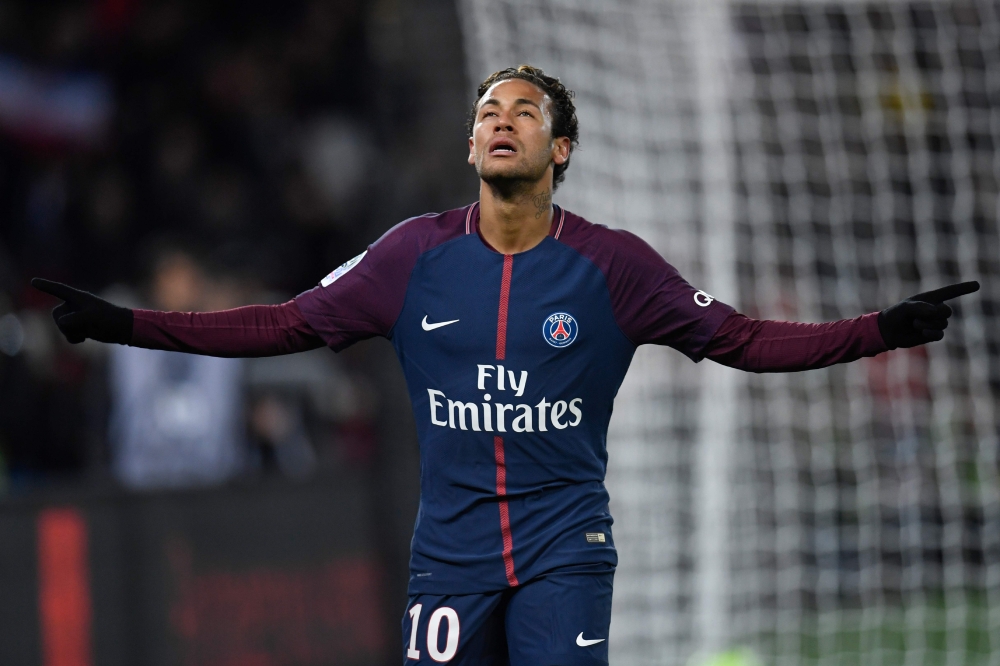 Paris Saint-Germain's Brazilian forward Neymar celebrates after scoring his team's fifth goal during the French L1 football match against Dijon on Wednesday at the Parc des Princes stadium in Paris. — AFP