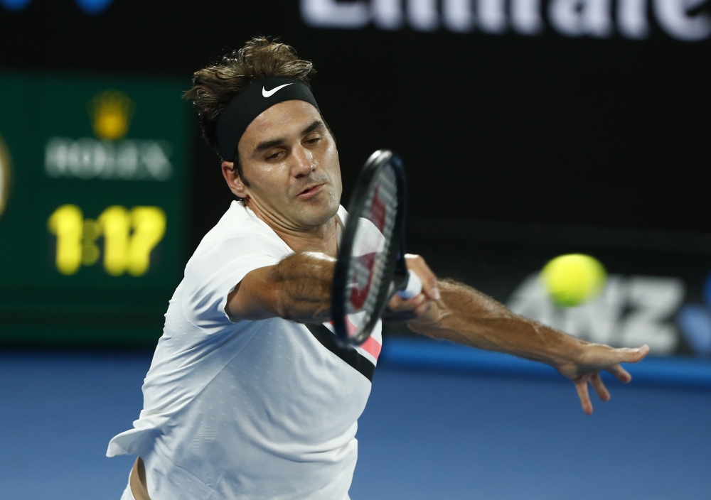 Switzerland's Roger Federer in action during his match against Germany's Jan-Lennard Struff during their men's singles second round match of the Australian Open tennis tournament in Melbourne on Thursday. — Reuters