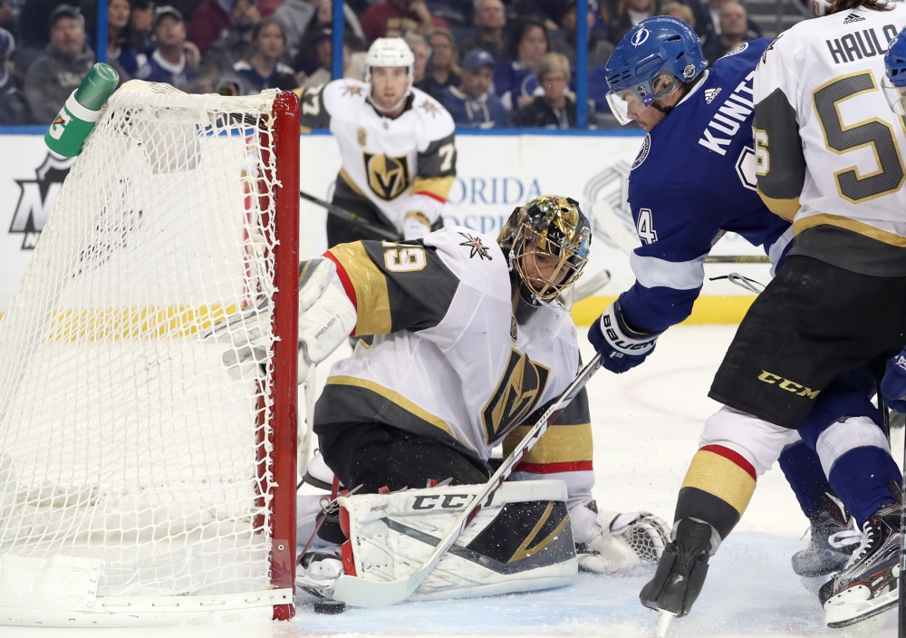 Tampa Bay Lightning left wing Chris Kunitz (14) shoots as Vegas Golden Knights goaltender Marc-Andre Fleury (29) makes a save during the third period at Amalie Arena. — Reuters