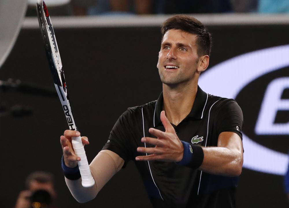 Serbia’s Novak Djokovic celebrates winning his match against Spain’s Albert Ramos-Vinolas at the Australian Open Saturday. — Reuters