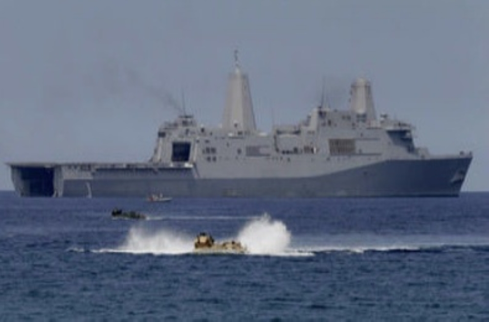 US Navy’s amphibious assault vehicles with Philippines and US troops on board maneuver in the waters during a combined assault exercise facing the contested Sacarborough Shoals, near the waters of the Philippines in this file photo. — AP
