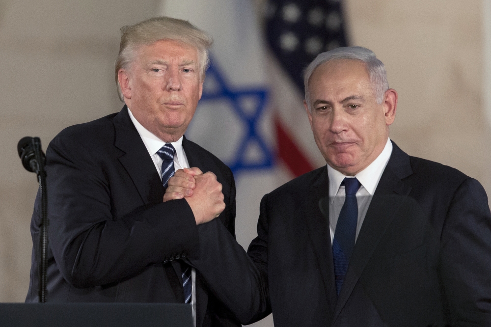 In this May 23, 2017 file photo, US President Donald Trump, left, shakes hands with Israeli Prime Minister Benjamin Netanyahu at the Israel Museum in occupied Jerusalem. — AP