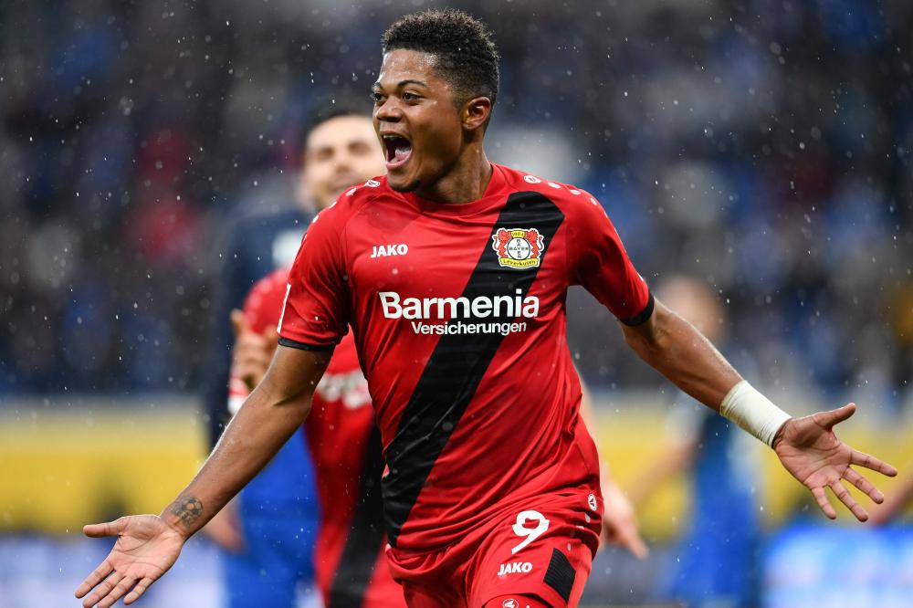 Leverkusen's Jamaican midfielder Leon Bailey celebrates after scoring during the Bundesliga football match against TSG 1899 Hoffenheim in Sinsheim, southwestern Germany, Saturday. — AFP