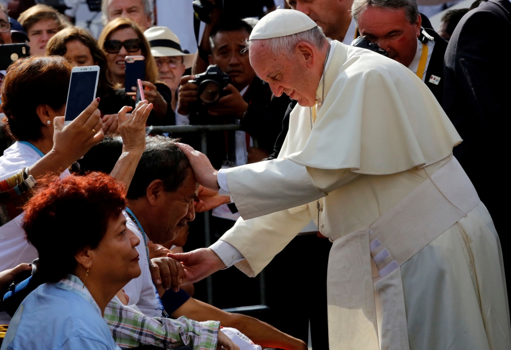 Pope Francis greets faithful as he arrives to lead the Marian celebration of the Virgin de la Puerta in Trujillo, Peru, on Saturday. — Reuters