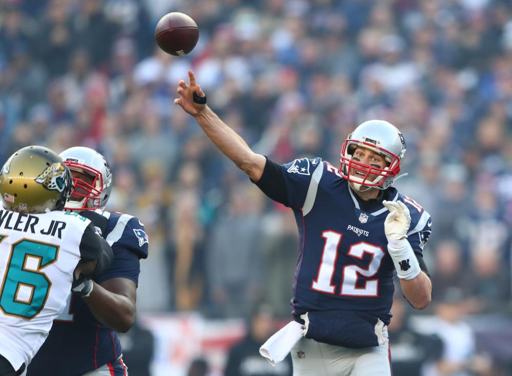 New England Patriots’ quarterback Tom Brady throws a pass against the Jacksonville Jaguars during their AFC Championship Game at Gillette Stadium Sunday. — Reuters