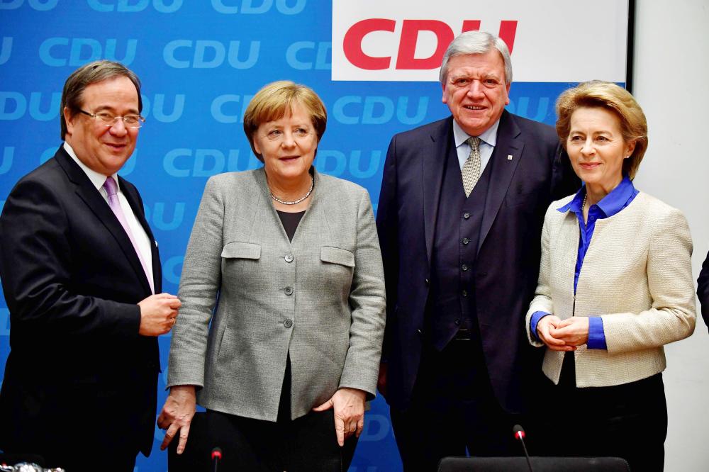 Christian Democratic Union (CDU) party's state leader in North Rhine-Westphalia Armin Laschet, German Chancellor Angela Merkel, State Premier of Hessen and CDU party member Volker Bouffier and Minister of Defence Ursula von der Leyen pose after a leadership meeting at the CDU headquarters in Berlin on Sunday. — AFP