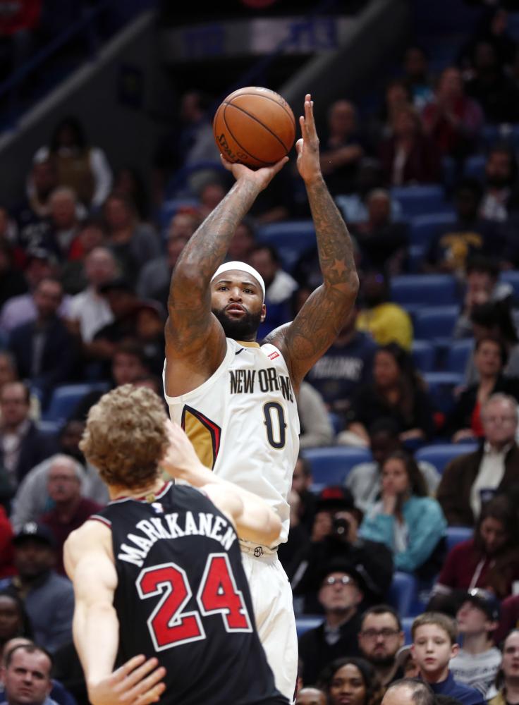 New Orleans Pelicans’ center DeMarcus Cousins shoots over Chicago Bulls’ forward Lauri Markkanen during their NBA game in New Orleans Monday. — AP