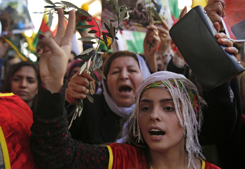Kurdish demonstrators, some holding olive branches, protest at the Russian embassy, in Beirut, Lebanon, against the operation by the Turkish army aimed at ousting the US-backed Kurdish militia from the area in Afrin, Syria. — AP