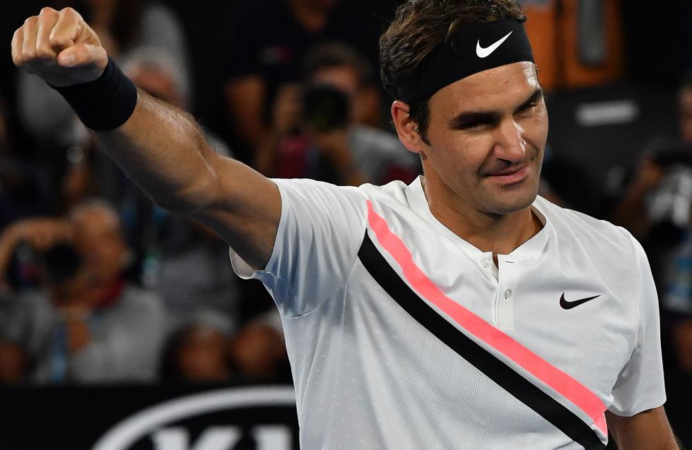 Switzerland’s Roger Federer celebrates beating Czech Republic’s Tomas Berdych at the Australian Open Wednesday. — AFP