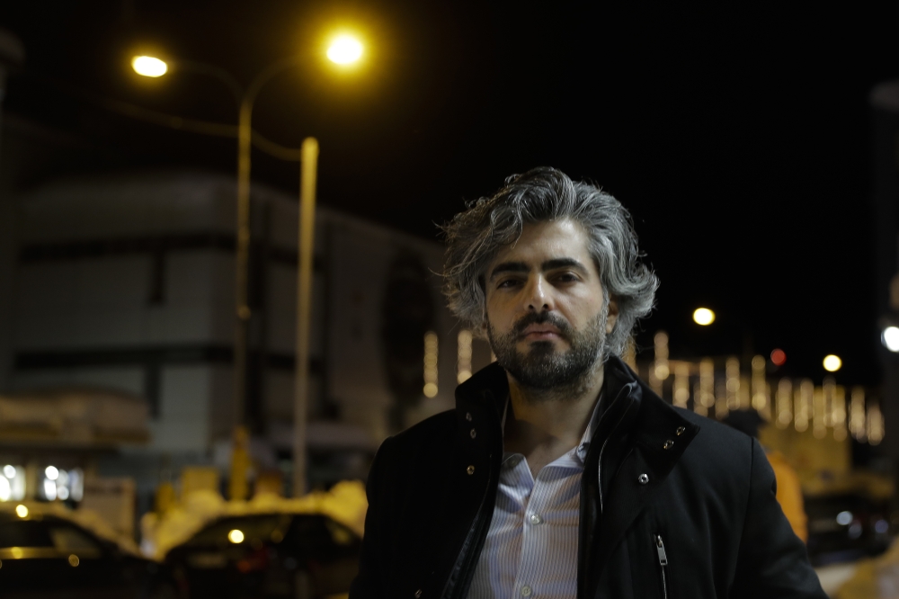 Syrian director Firas Fayyad poses for a photo after an interview in Davos, Switzerland on Wednesday. His movie 