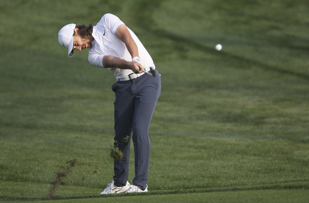 England's Tommy Fleetwood plays a shot on the 10th hole during the first round of the Dubai Desert Classic golf tournament in Dubaion Thursday. — AP 