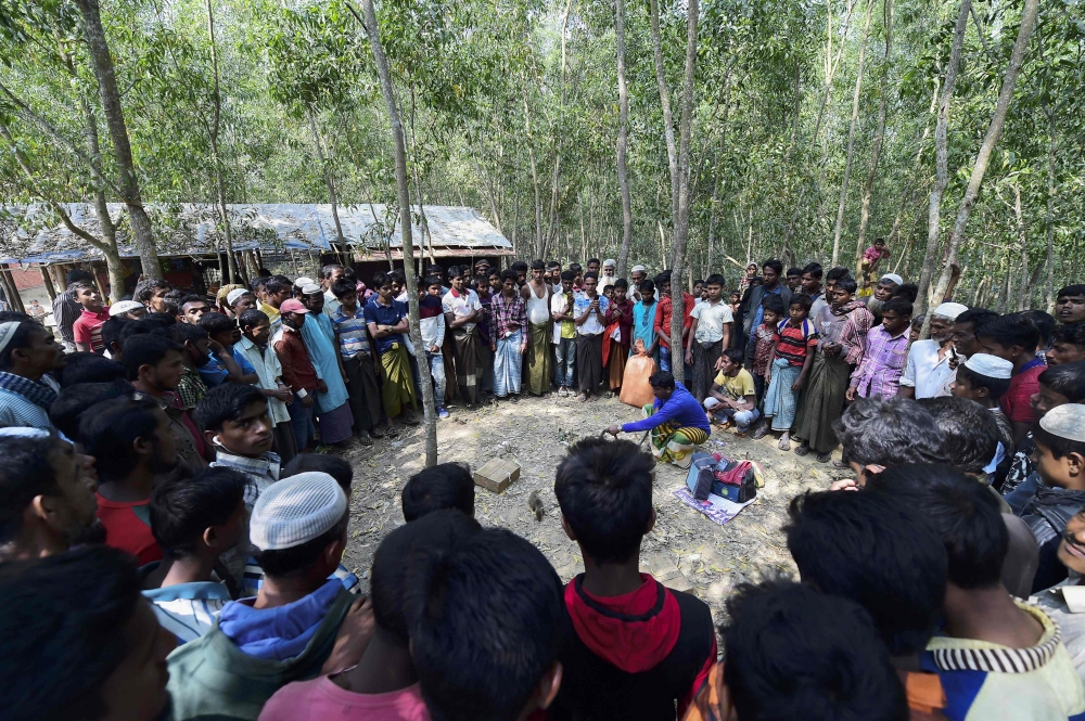 A Rohingya refugee girl swings outside her temporary shelter near Cox's Bazar, Bangladesh. A Bangladesh official says Rohingya refugees are continuing to flee from Myanmar into Bangladesh, even after the two countries said they will begin repatriating members of the minority ethnic group next week. — AP