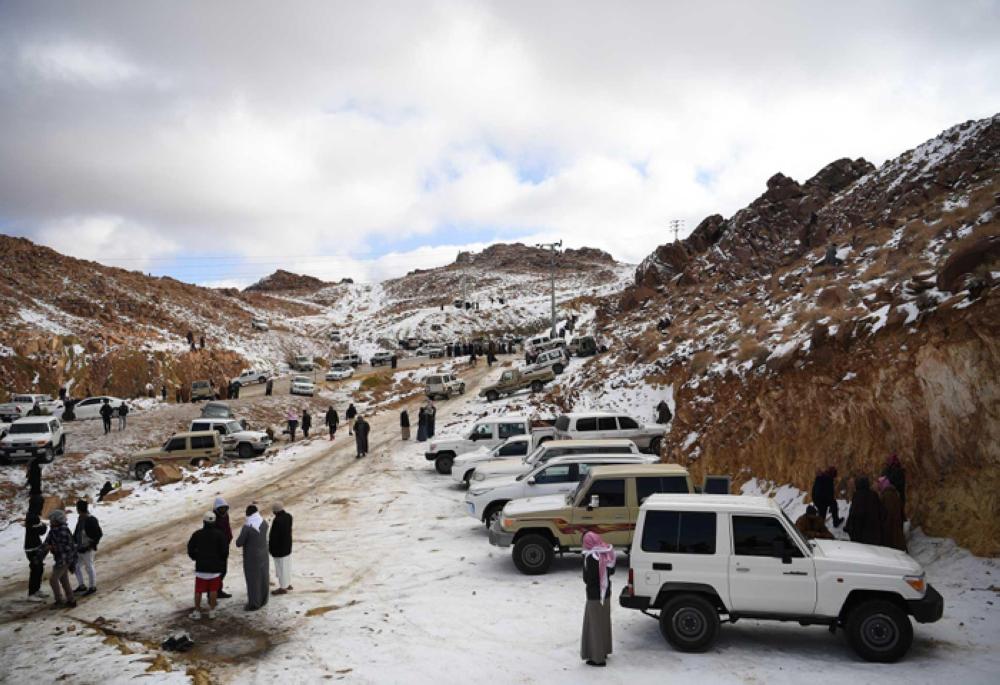Families enjoy day of sledding as snow drapes Saudi Arabian mountains