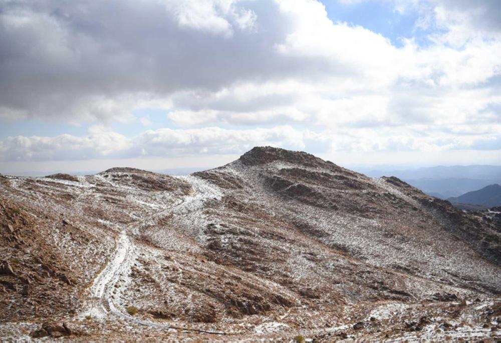 Families enjoy day of sledding as snow drapes Saudi Arabian mountains