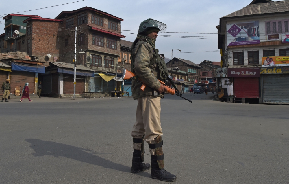 An Indian paramilitary trooper stands guard during a restriction by government forces in Srinagar on Sunday. — AFP