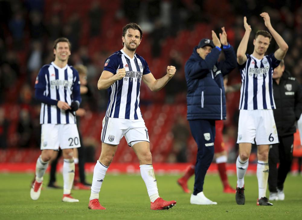 West Bromwich Albion’s Jay Rodriguez celebrates after the final whistle of the English FA Cup match against Liverpool at the Anfield Stadium, Liverpool, Saturday. — AP