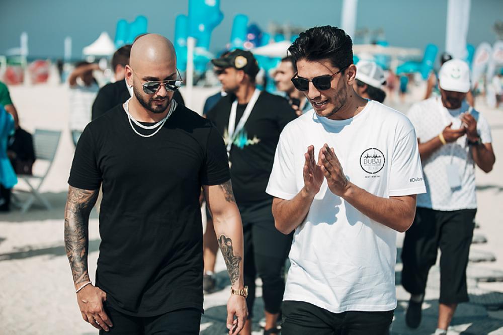 Singer Massari, left, and Mohammed Assaf are seen as they shoot the music video for 