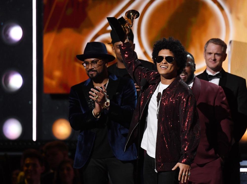 Bruno Mars receives his third Grammy for Album of the Year during the 60th Annual Grammy Awards show on January 28, 2018, in New York. — AFP