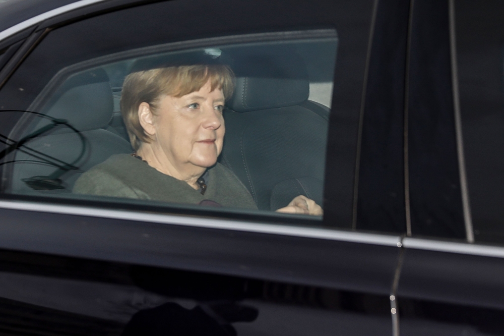 German Chancellor Angela Merkel arrives at the Konrad Adenauer building, the Christian Democratic Union (CDU) headquarters, for coalition talks to form a new government, on Sunday. — AFP