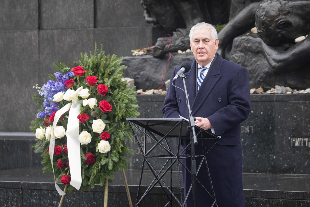 Secretary of State Rex Tillerson speaks during a wreath laying ceremony in front of the Monument to the Ghetto Heroes in Warsaw on Saturday. — AFP
