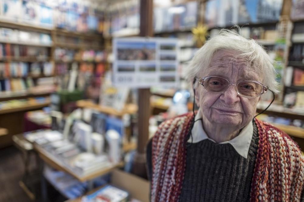 Bookshop owner Helga Weyhe poses in her bookshop in the German town of Salzwedel. When Helga began work at her beloved bookshop, the Red Army was on the march toward her east German town, Hitler still clung to power and Sartre had just published 