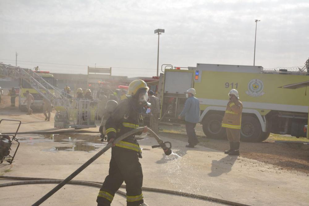 Civil Defense personnel extinguishing a fire that broke out at the electricity power transmission station in Jeddah on Monday. — Okaz photo