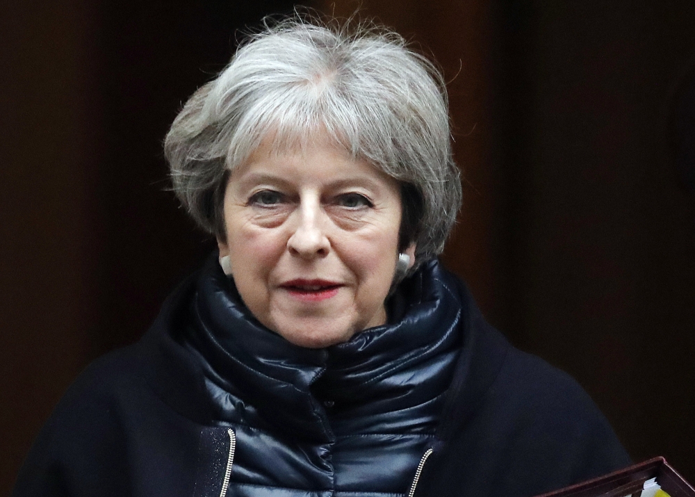 Britain’s Prime Minister Theresa May leaves 10 Downing Street to attend the weekly Prime Ministers’ Questions session in parliament in London in this Jan. 10, 2018 file photo. — AP