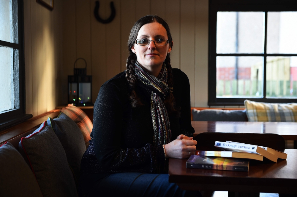 Scottish author Claire McFall poses in Lesmahagow, south of Glasgow. McFall, a small-town schoolteacher has become an international literary sensation with more than a million sales in China and a Hollywood movie deal - but remains relatively unknown in her homeland. - AFP