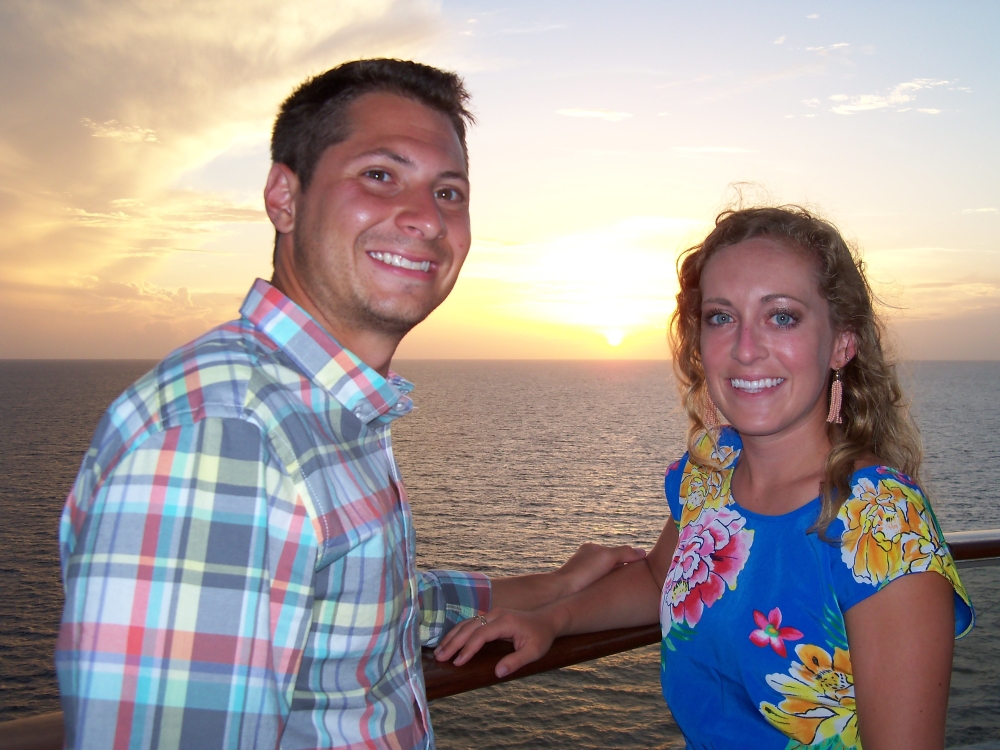 In this June 17, 2017 photo, Zach and Alyssa Bynum of Louisville, Kentucky, were among several couples posing on a top deck for photos at sunset aboard the Celebrity cruise ship Equinox. The honeymooners were on their first cruise. - AP