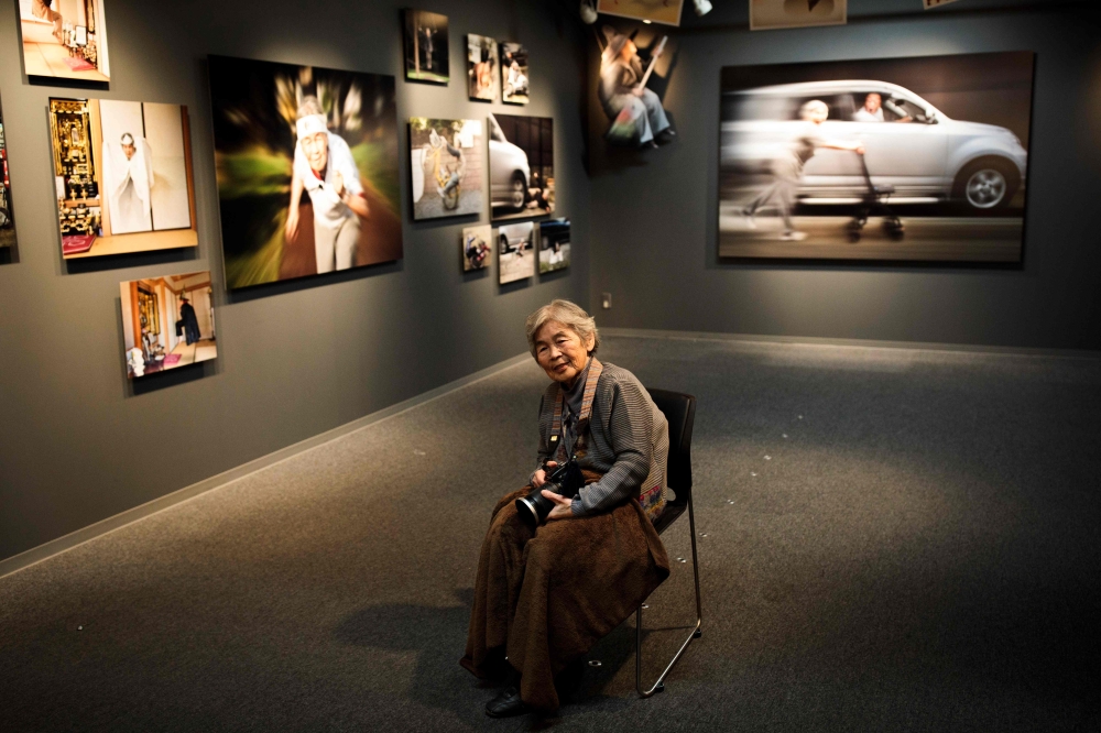In this picture taken on Jan. 16, Kimiko Nishimoto checks her smartphone at her house in the western Japanese city of Kumamoto. The madcap Japanese great-grandmother armed with a camera and an appetite for mischief has shot to fame for taking side-splitting selfies — many of which appear to put her in harm's way. — AFP photos