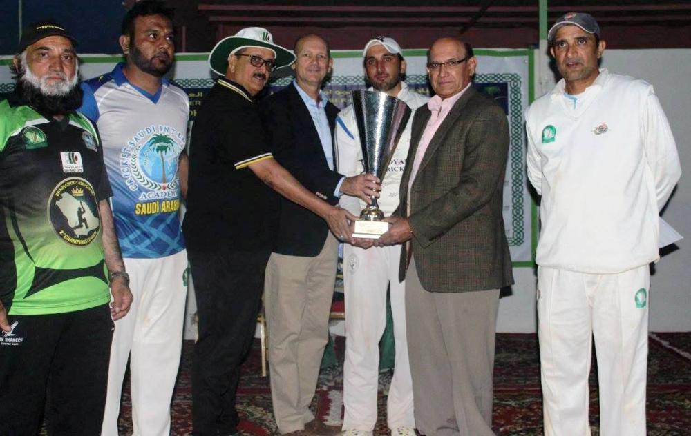 Pak Shaheen captain receiving Al-Kharj League Trophy from guests.