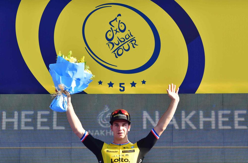 Dutch rider Dylan Groenewegen of team Lotto NL-Jumbo celebrates on the podium after winning the first stage of the Dubai Tour from Sky Dive Dubai to Palm Jumeirah in Dubai Tuesday. — AFP 