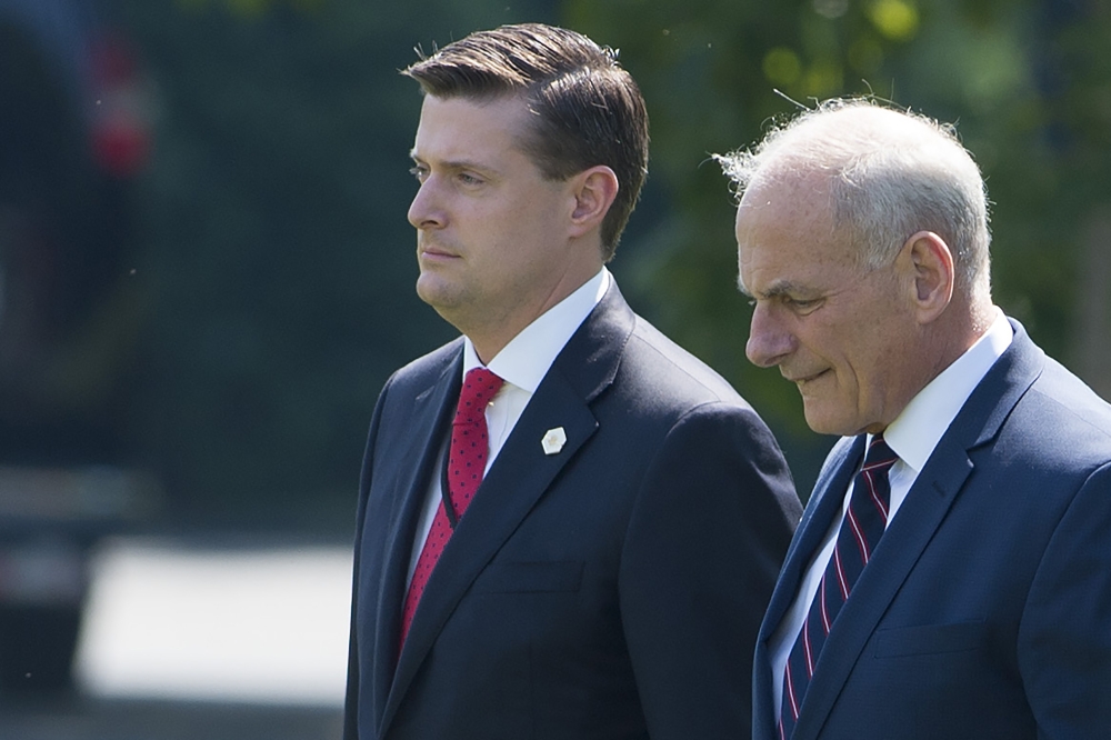 White House Chief of Staff John Kelly, right, and White House Staff Secretary Rob Porter, left, walk to Marine One prior to departure from the South Lawn of the White House in Washington in this Aug. 4, 2017 file photo. —