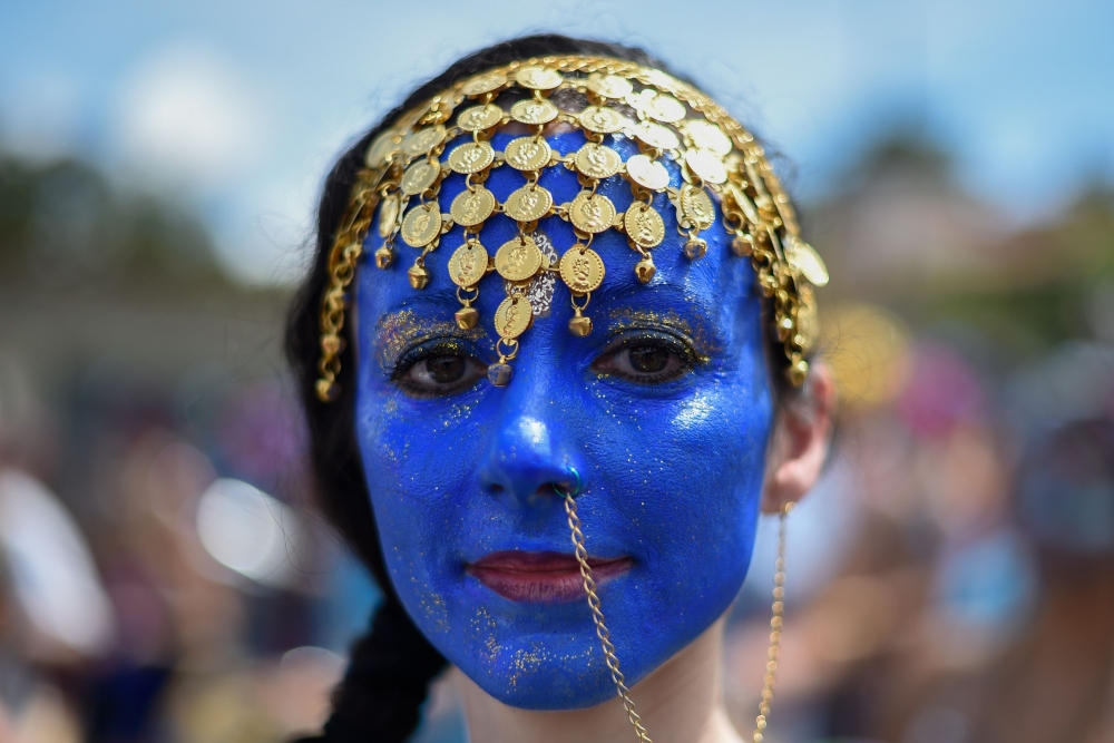 A member of the Pena de Pavao de Krishna traditional carnival school performs in Belo Horizonte, Brazil, on Monday. - AFP