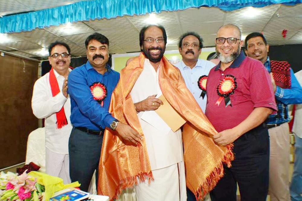 Tiruchi Siva, member of Parliament (India) and Dravida Munnetra Kazagham (DMK) Party propaganda secretary is being presented with the traditional shawl (above) by the Tamil Diaspora at an event in Jeddah. — Courtesy photos
