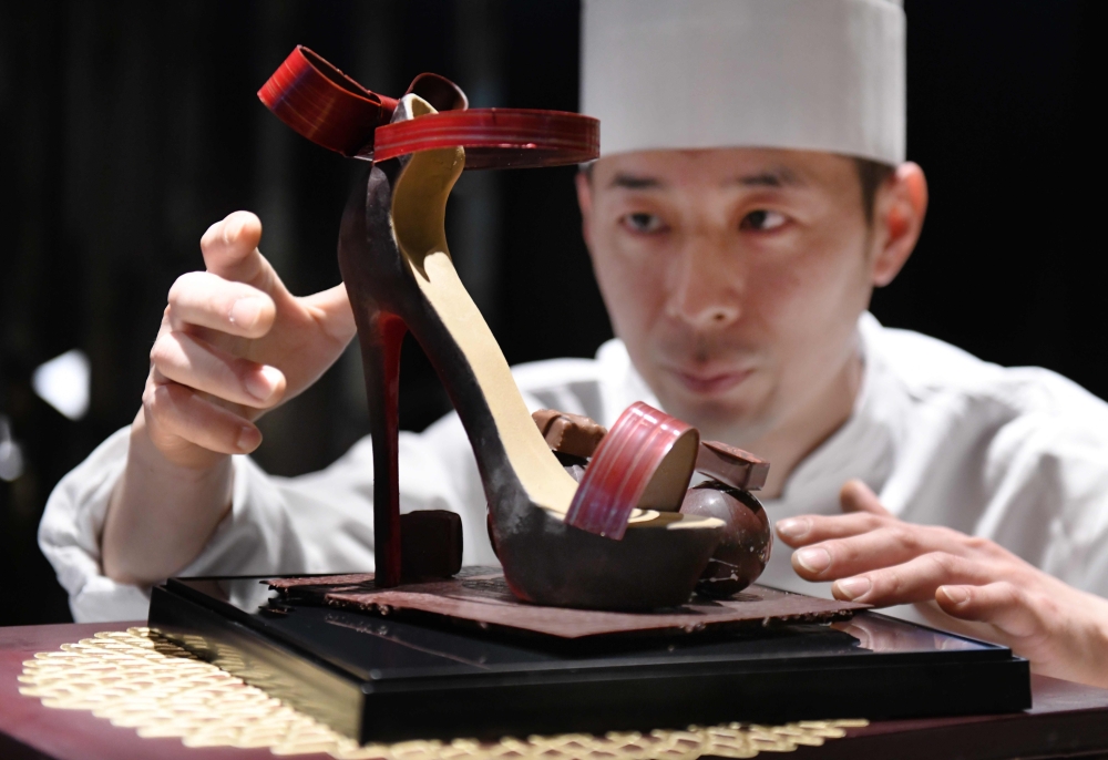 Japanese chocolatier Kazuya Nagata checks his work 