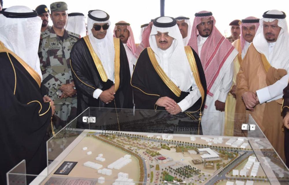 Prince Saud Bin Naif, emir of the Eastern Province, inspects the model of projects during the foundation stone laying ceremony in Awamiya on Tuesday. — SPA