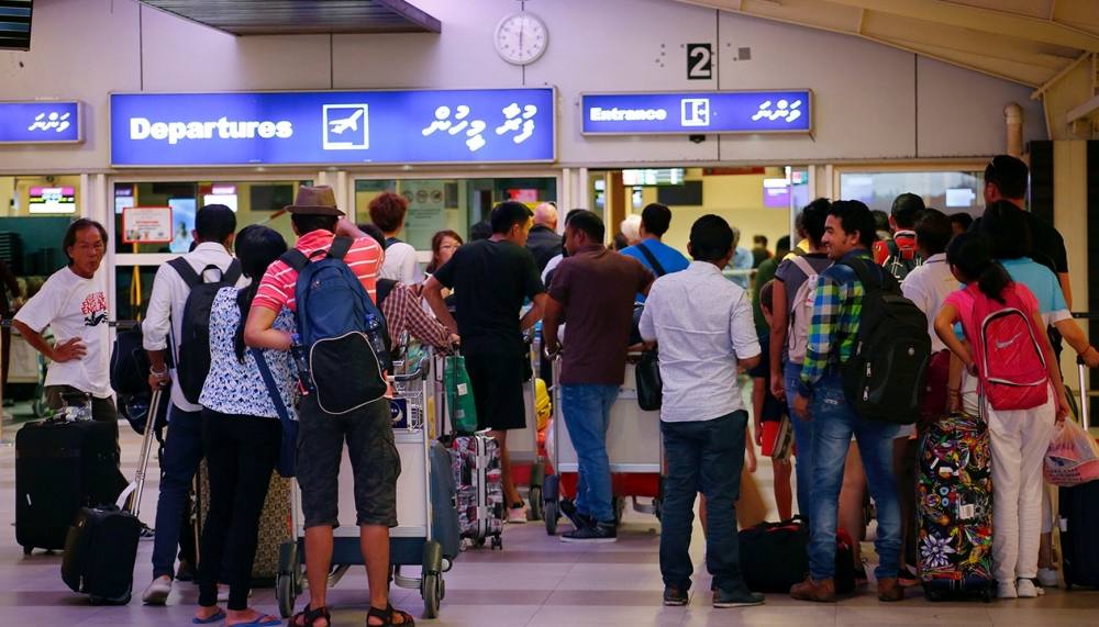 Tourists wait in the departures hall at Velana International Airport in Male, Maldives, on Tuesday. — Reuters