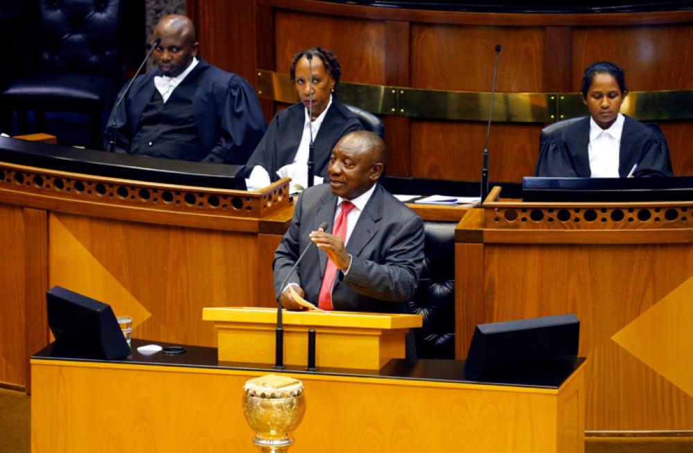 South Africa's new president Cyril Ramaphosa (center) delivers a speech after being elected by the Members of Parliament during his swearing in ceremony at the Parliament in Cape Town, Thursday. — AFP
