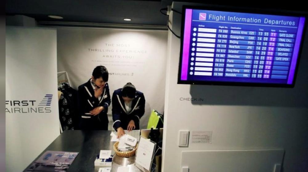 Staff dressed as flight attendants. work at the ‘First Airlines’, virtual first-class airline experience facility in Tokyo on Wednesday. — Reuters