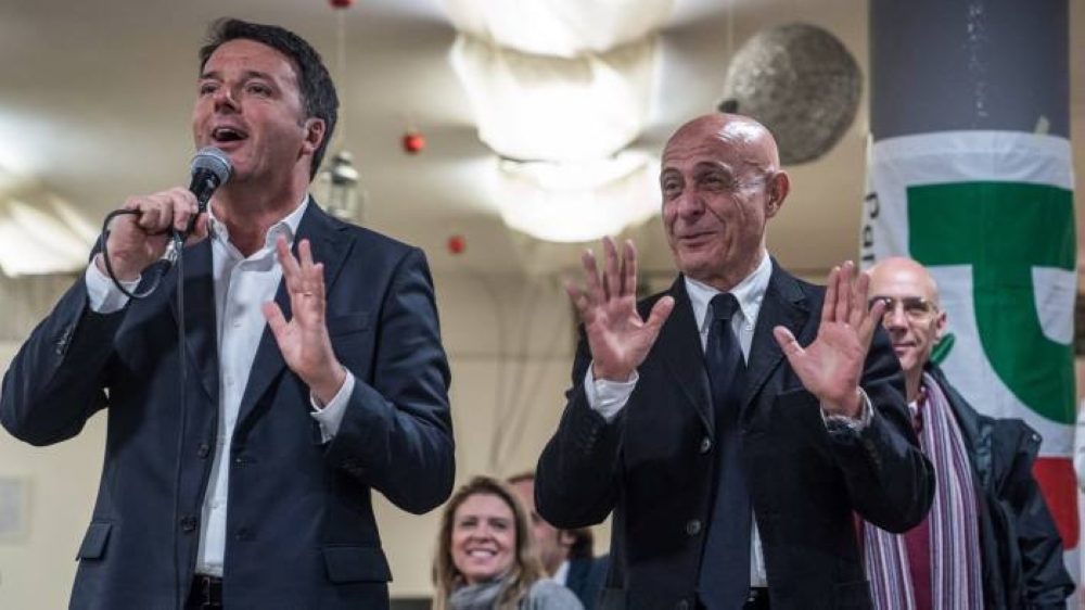 Matteo Renzi, the Democratic party leader (left), and Marco Minniti, Italy's interior minister, speak at a campaign event in Florence. — Courtesy photo